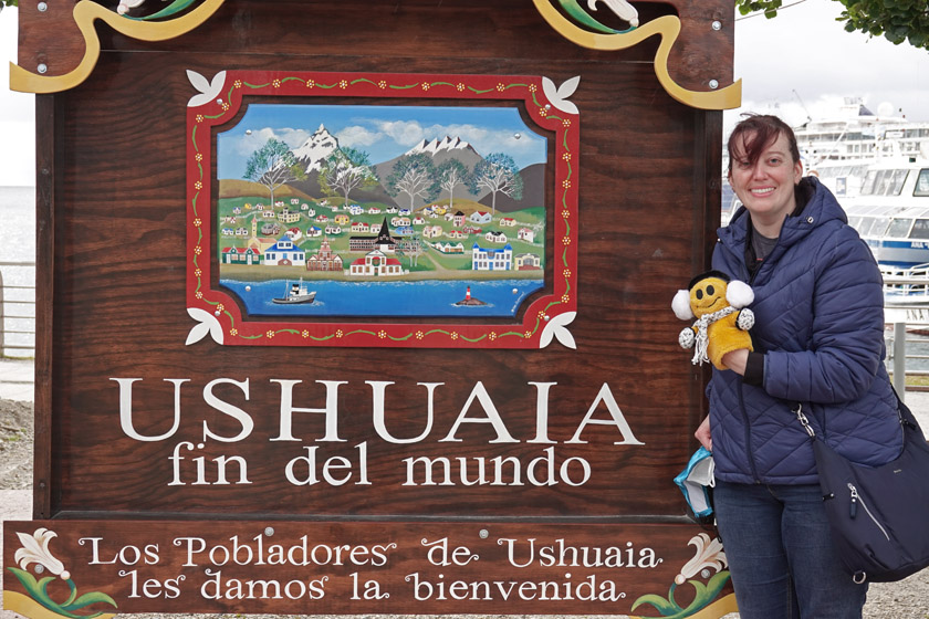 Becky and Mr. Happy at Ushuaia Sign at the End of the Antarctic Expedition