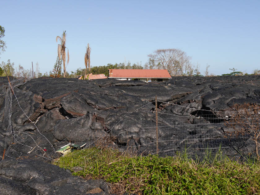 House and Garage Surrounded by Recent Lava Flow at Pahoa, Hawaii