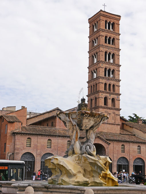 Fountain at Temple of Hercules Victor and Bell Tower of Santa Maria in Cosmedin